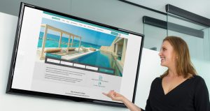 BRESI- Staff-looking-at-bresi-website-on-a tv
