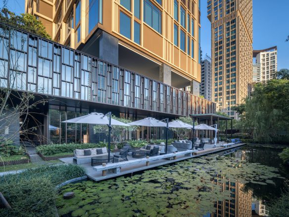 Kimpton Maa-Lai Bangkok features 131 apartments with one to three bedrooms, each equipped with a full kitchen, stylish furnishings, and lush green views.