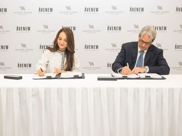 Rasha Hassan, Managing Partner AVENEW Development & Guy Hutchinson, President MEA, Hilton signing for Waldorf Astoria Residences Dubai Islands